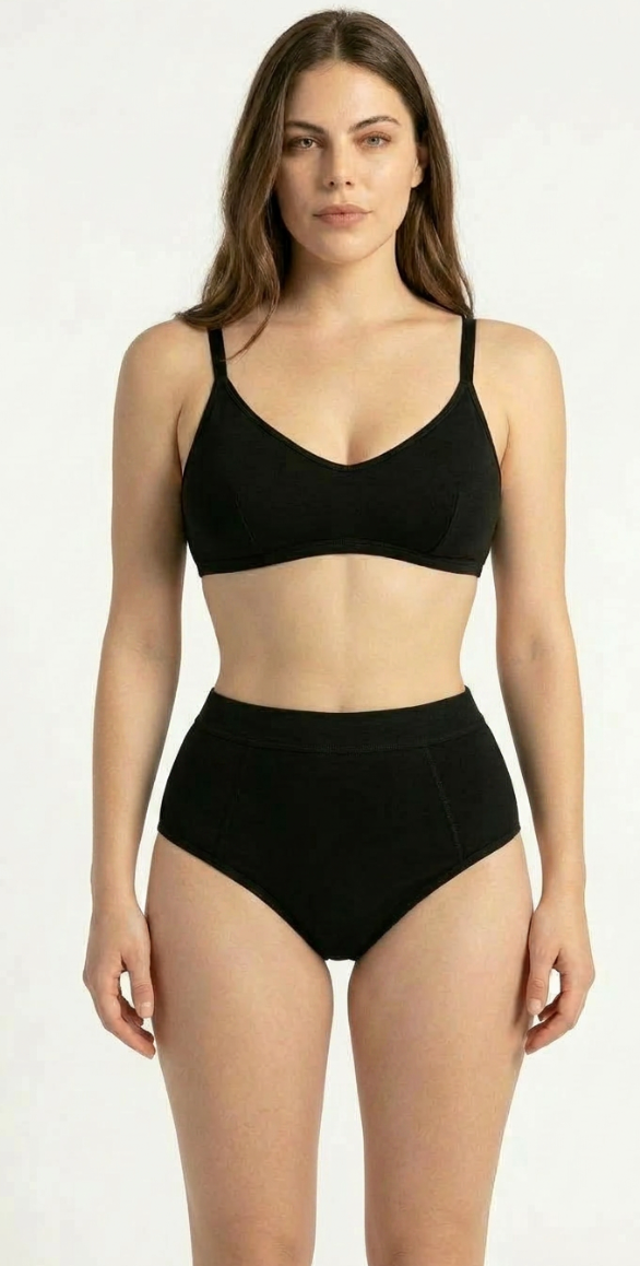 Model wearing SweeTee black hiphugger period underwear with matching bralette