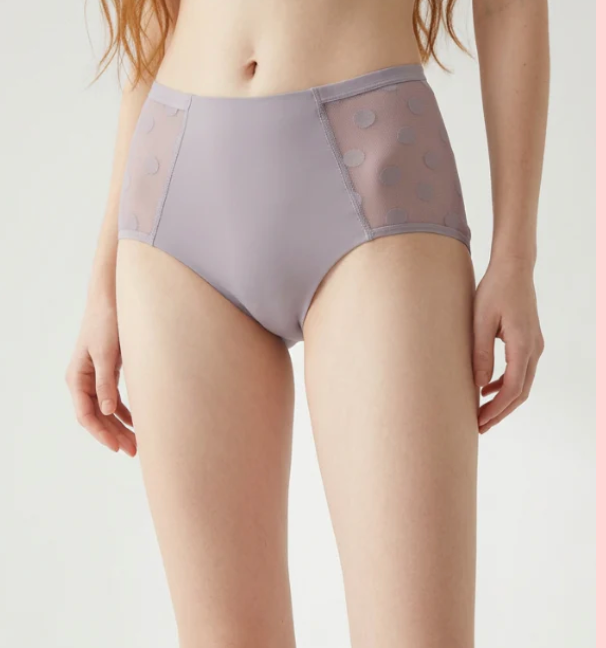 Model wearing SweeTee lavender lace high-waist period underwear with polka dot mesh sides, most viewed style